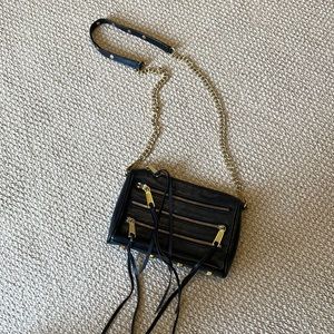 Black Rebecca Minkoff crossbody bag with gold hardware